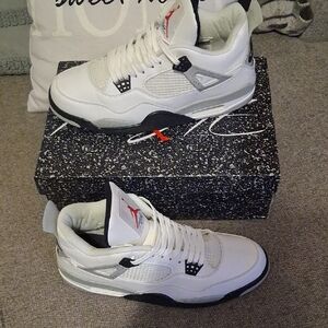 White and Black Sneakers with Red Accents